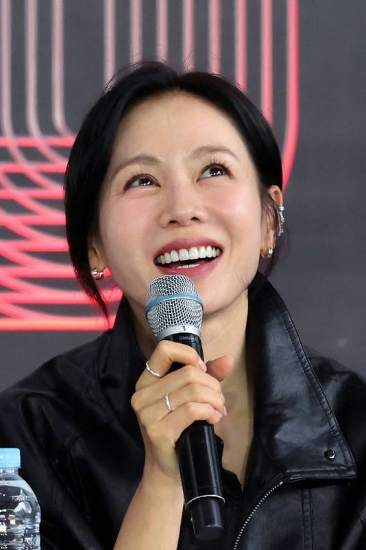 Son Ye-jin BIFF 2025person' 'smiling' 'microphone' 'leather' 'jacket' 'earrings.
