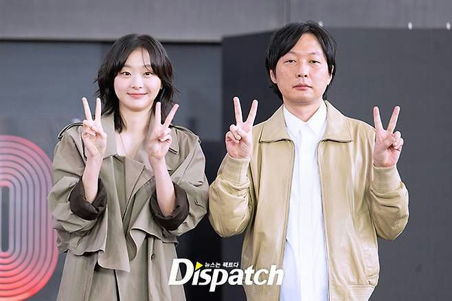 Kim Da-mi The Great Flood BIFF 2025two' 'people' 'peace' 'sign' 'trench' 'coat' 'jacket.