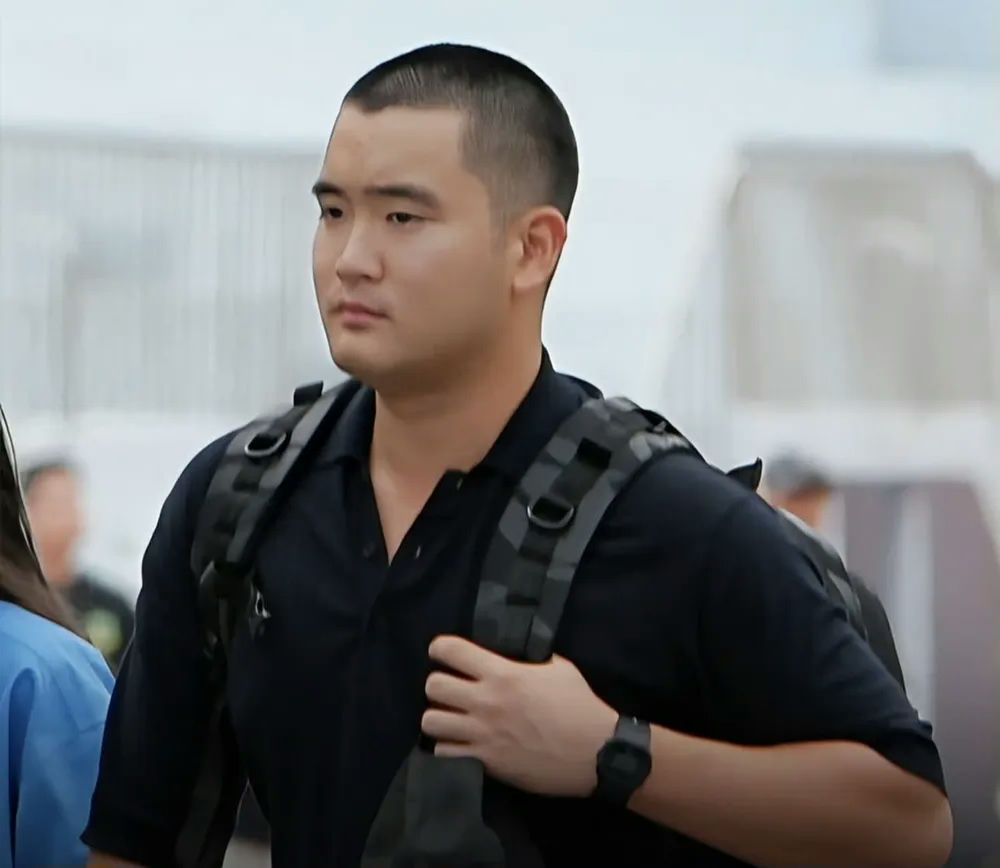 Samsung heir Lee Jee-ho military serviceperson' 'backpack' 'watch' 'serious' 'outdoors.