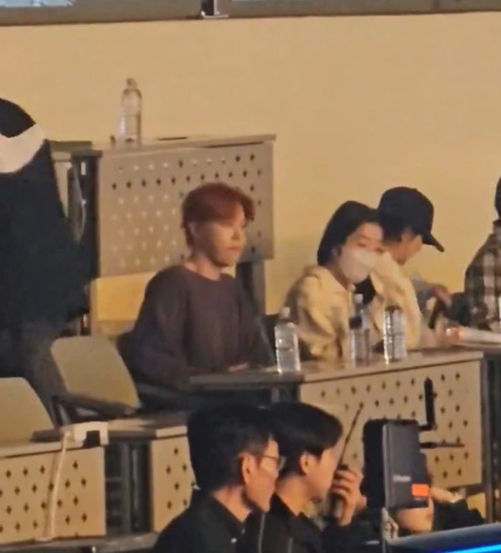 Suho and Irene dating rumors 2025people' 'sitting' 'conference' 'masks' 'bottles.