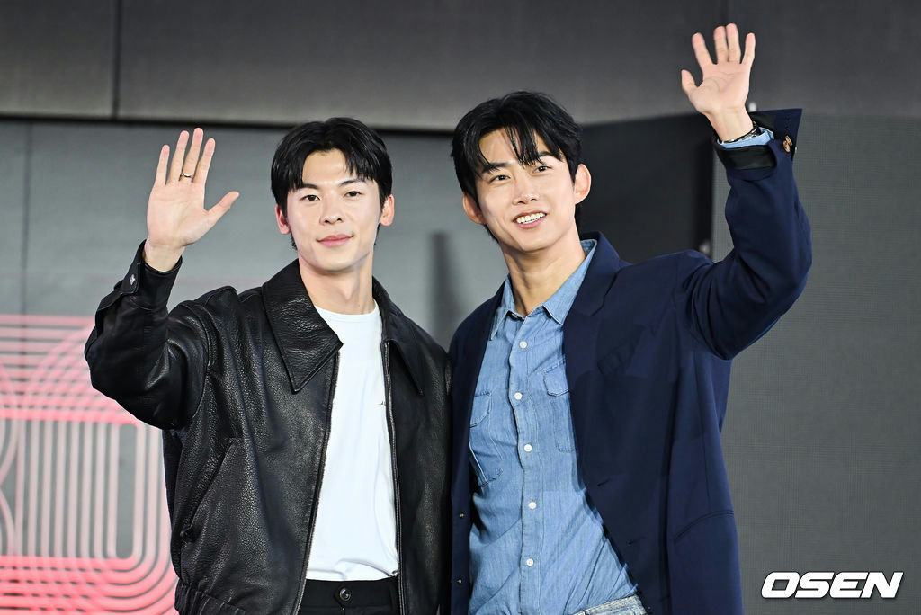 Greg Hsu Ok Taecyeon BIFF 2025people' 'two' 'waving' 'smiling' 'jacket.