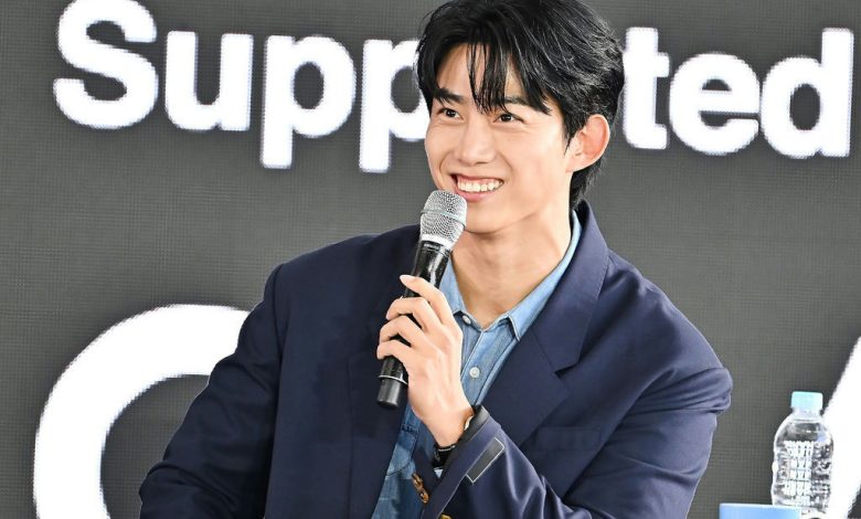 Greg Hsu Ok Taecyeon BIFF 2025person' '' 'k' '' 'aecyeon' 'microphone' 'navy' 'blazer' 'denim' 'shirt.
