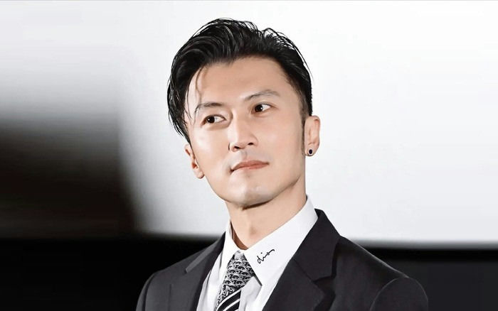 Nicholas Tse typhoon Ragasa photo viralman' 'suit' 'earring' 'serious' 'tie.