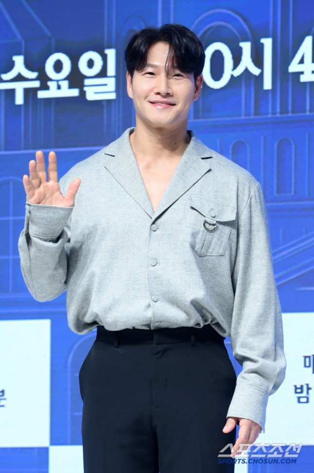 Kim Jong Kook newlywed first updateperson' 'smiling' 'waving' 'collared' 'shirt' 'black' 'pants.