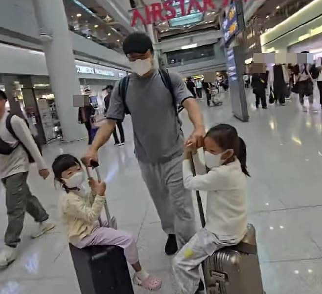 J.Y. Park family trip daughters privacypeople' 'airport' 'luggage' 'mask' 'family.