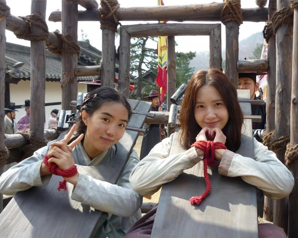 Girls’ Generation YoonA praised by co-starspeople' 'hands' 'tied' 'historical' 'drama' 'wooden' 'structure' 'outdoors.