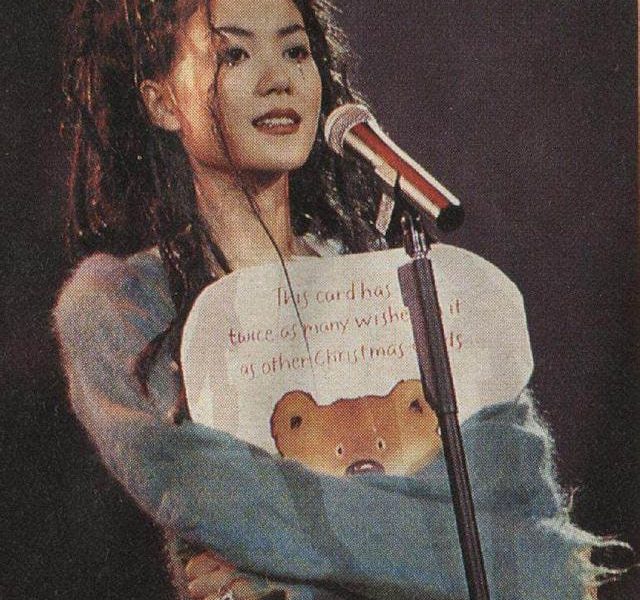 Faye Wong Jack Ma 22 million performanceperson' 'singing' 'microphone' '' 'hristmas' 'card' 'bear.