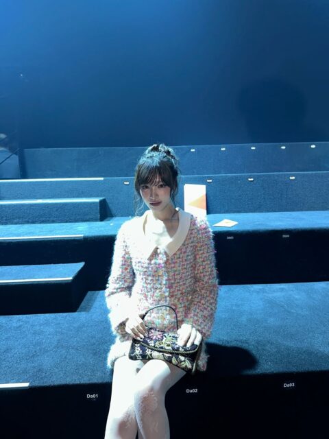 IVE Liz Paris Fashion Week interactionpeople' '' 'ne' 'seated' 'purse' 'jacket' 'tights.