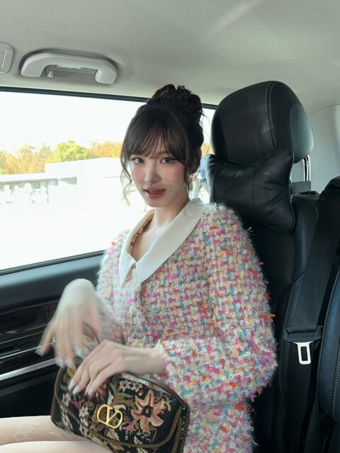 IVE Liz Paris Fashion Week interactionperson' 'indoors' 'coat' 'handbag' 'car.