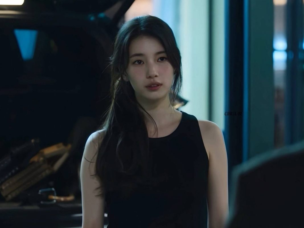 Suzy peak beautypeople' '' 'uzy' '' 'ae' 'black' 'top' 'long' 'hair' 'looking' 'aside.