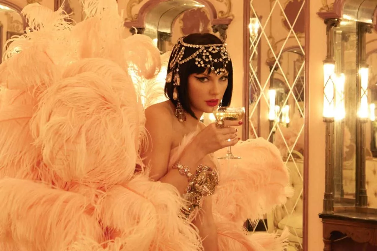 Kayla Nicole Taylor Swift Travis Kelcepeople' 'woman' 'feathers' 'champagne' 'jewelry.
