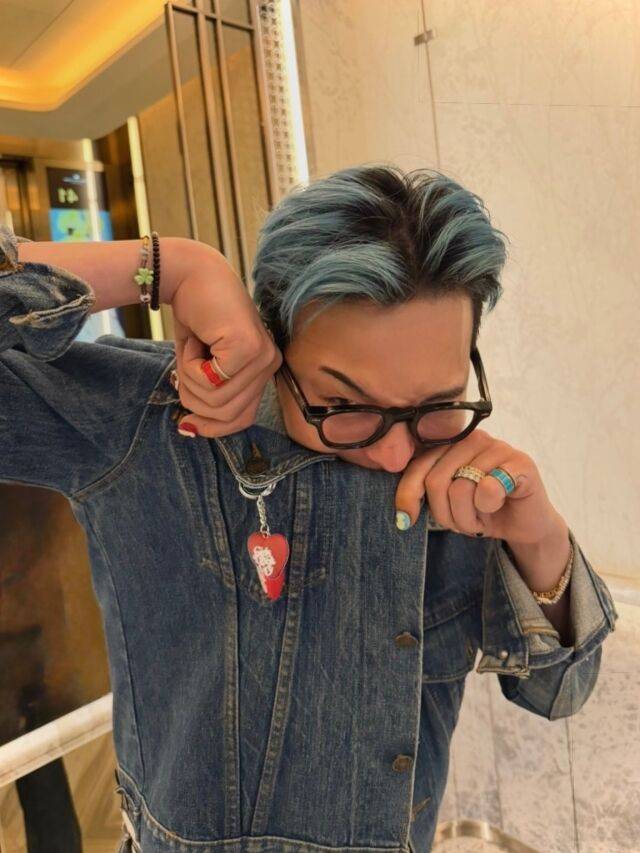 G-Dragon and BLACKPINK Lisa friendshipone' 'person' 'blue' 'hair' 'denim' 'jacket' 'rings' 'glasses.