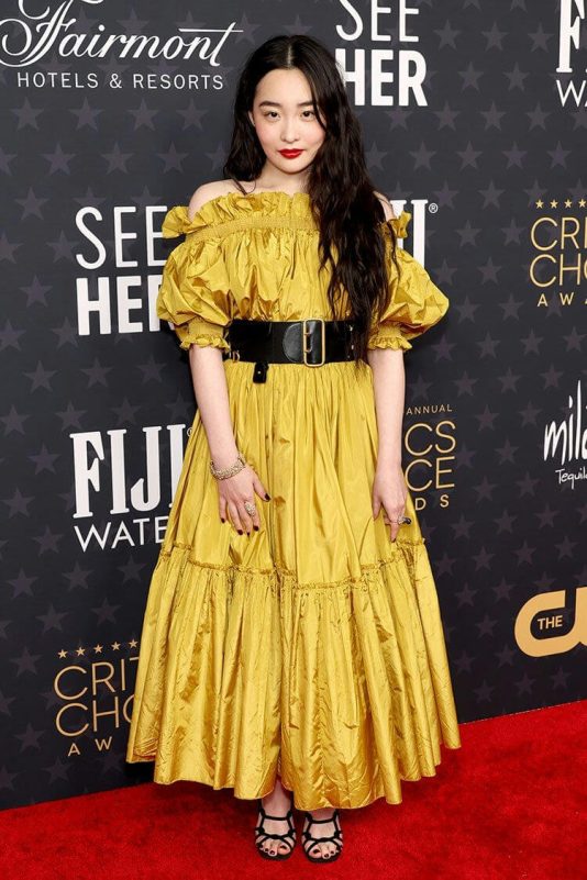 people-A-actress-A-yellow dress-A-black belt-A-red carpet