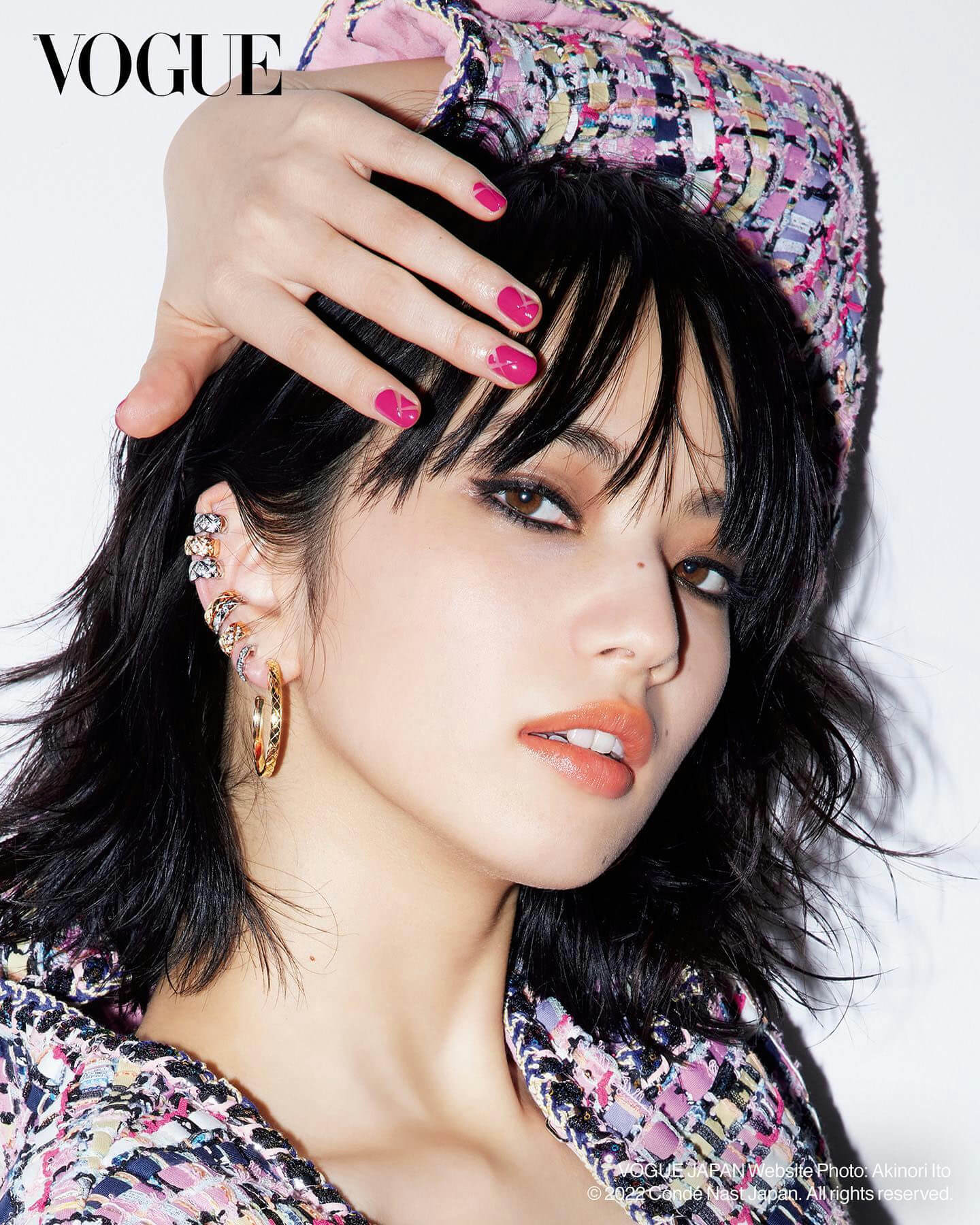 people-woman-Vogue-Magazine-earrings-manicured-nails-tweed-jacket