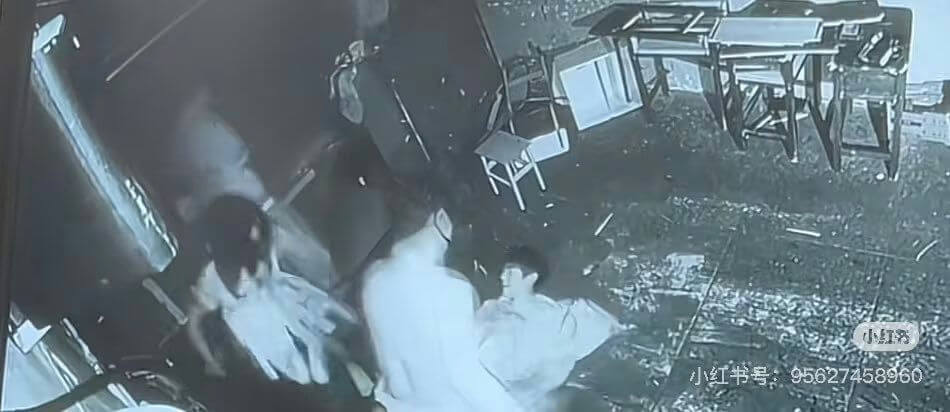 people-three individuals-A-low-quality footage-A-outdoor setting-A-overturned furniture