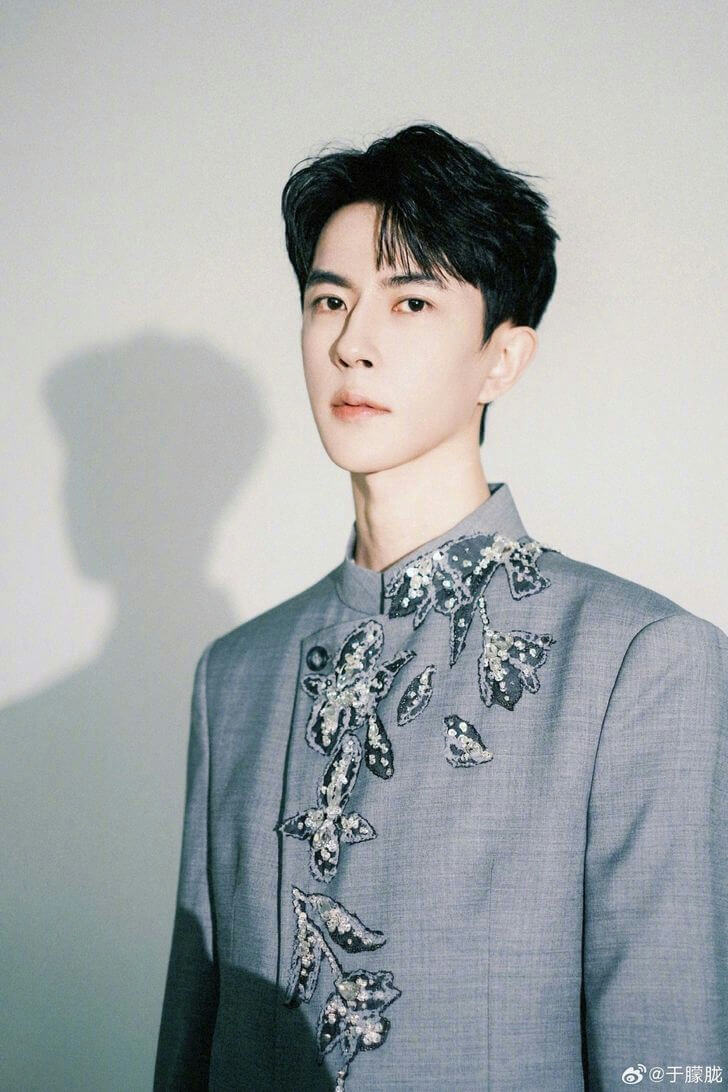 people-1-Asian man-A-black hair-A-grey embroidered suit jacket-A-studio portrait