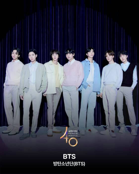 people-seven members of BTS-A-pastel colors-A-casual attire-A-stage setting-B-Golden Disc Awards logo-C