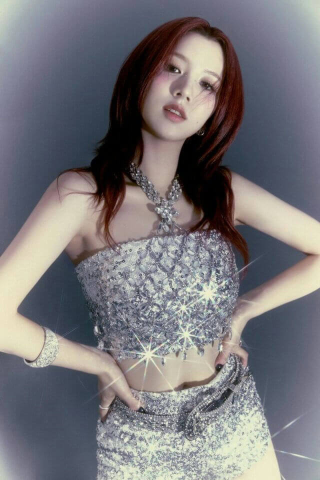 people-One woman-A-K-pop idol-A-Silver sequined outfit-B-Chunky diamond necklace-C-Reddish brown hair