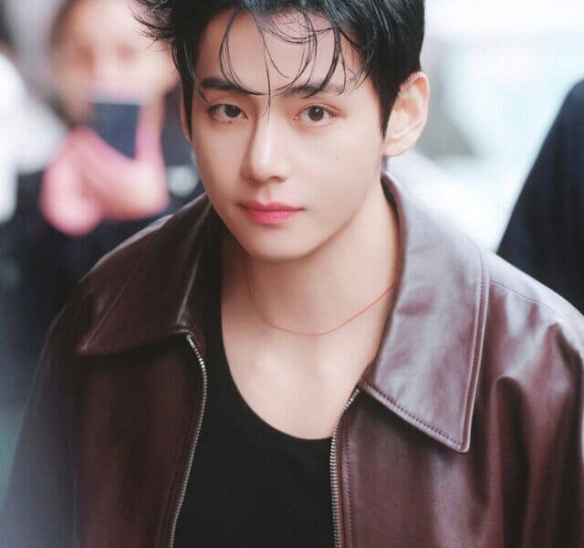 people-V (BTS)-A-male idol-A-dark hair-A-brown leather jacket-A-black shirt