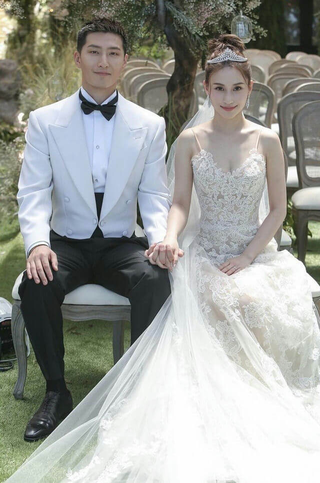 people-A-bride-and-groom-A-wedding-attire-B-holding-hands-C-outdoor-ceremony