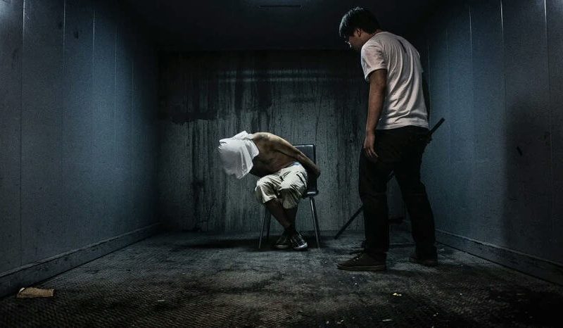 people-one person blindfolded and tied to a chair-A-interrogation-A-dark room-B-threat-C