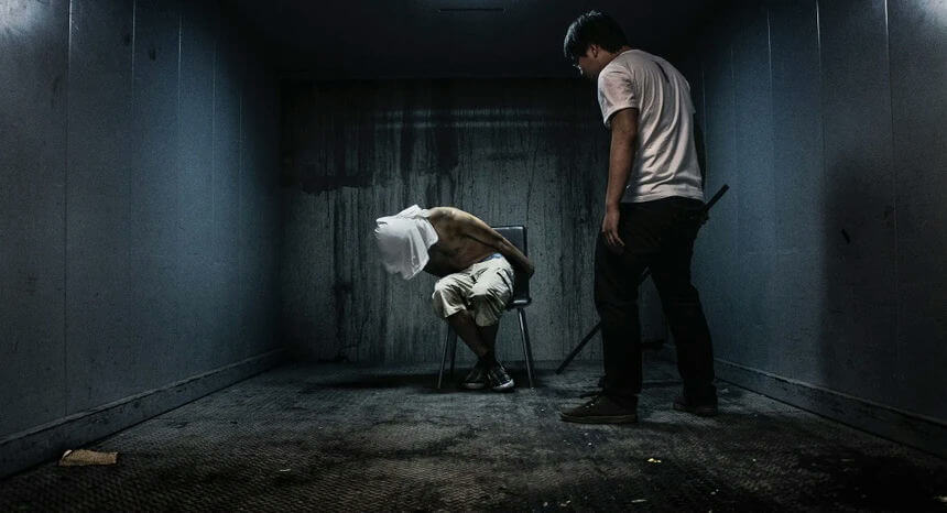 people-one person blindfolded and tied to a chair-A-interrogation-A-dark room-B-threat-C