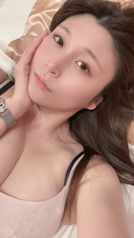 people-woman-lying down-close-up-light pink top-silver watch