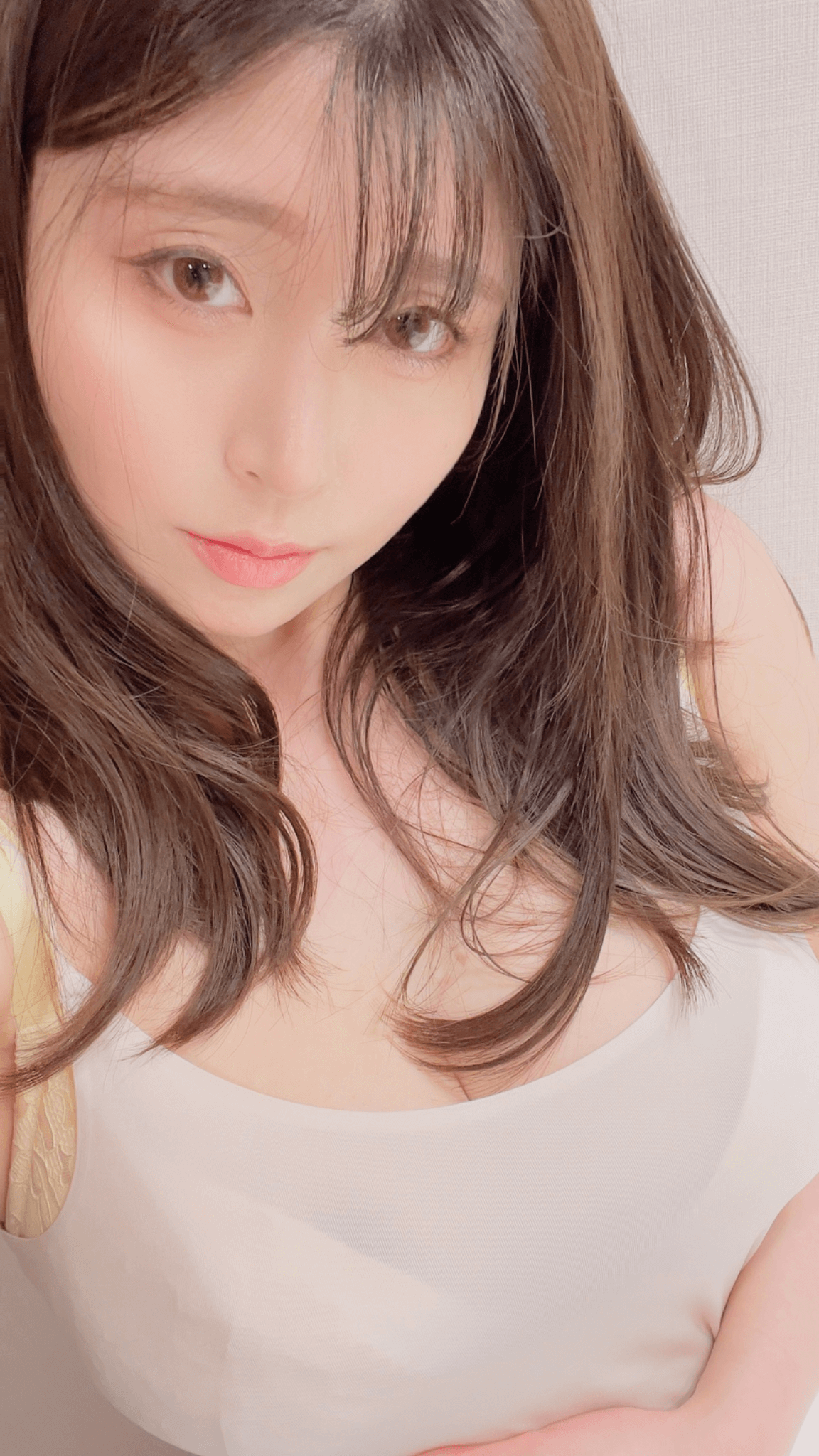 people-woman-A-long brown hair-A-soft focus-A-light colored tank top