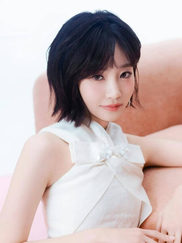 people-young woman-A-short black hair-A-white halter dress-B-large bow detail-C-soft lighting