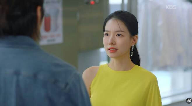 people-woman-yellow top-A-man with back to camera-A-dramatic expression-A-earrings