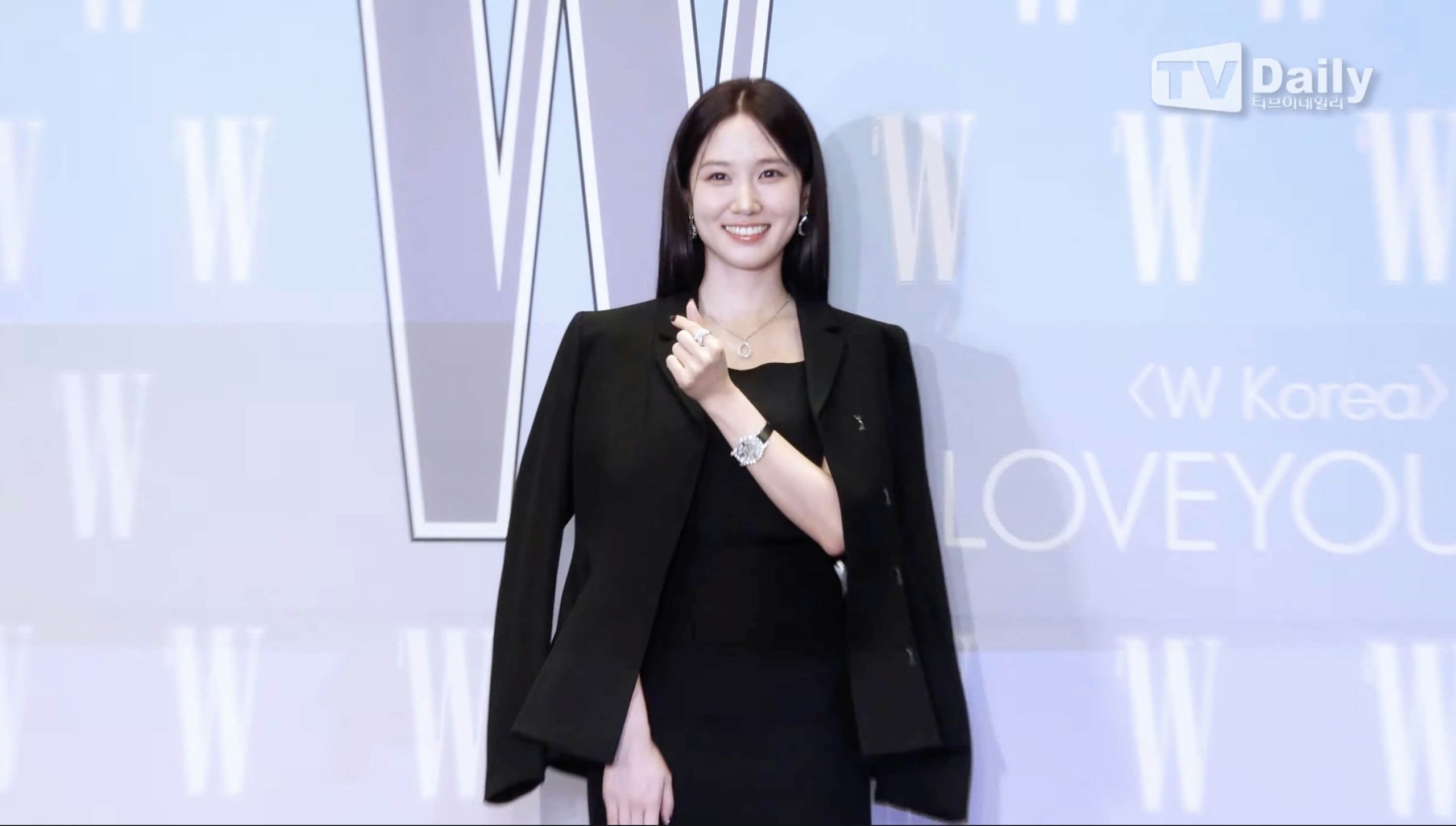 people-1-woman-A-black blazer-B-smiling-C-W Korea event