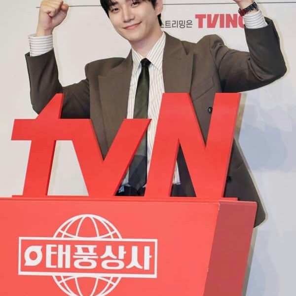people-Actor Lee Joon-young (U-KISS Jun)-A-fist pump-A-smiling-A-brown suit-B-red promotional sign-C