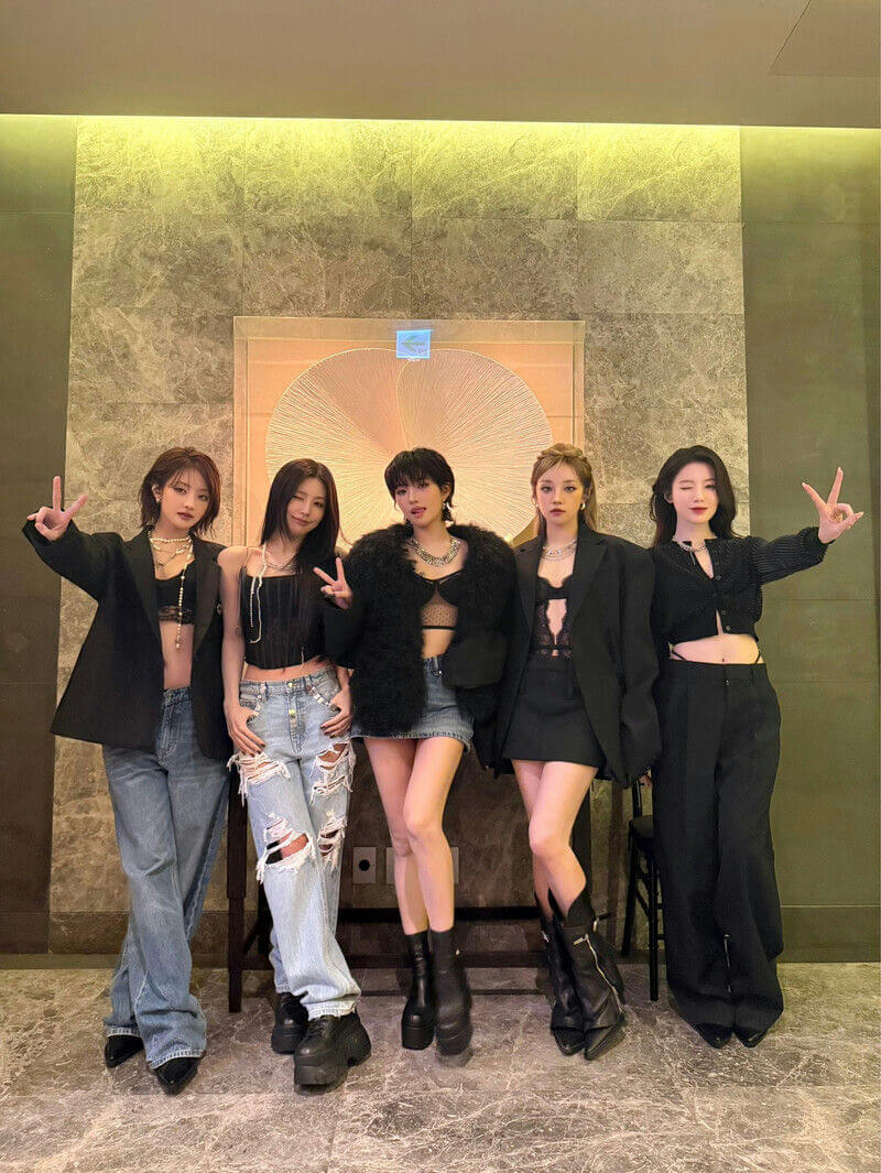 people-5-women-A-matching-outfits-A-black-jackets-A-crop-tops-A-fashionable-A-peace-signs