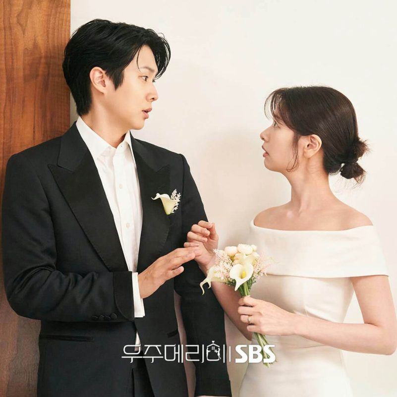 people-man and woman-A-wedding attire-B-looking at each other-C-holding hands/flowers