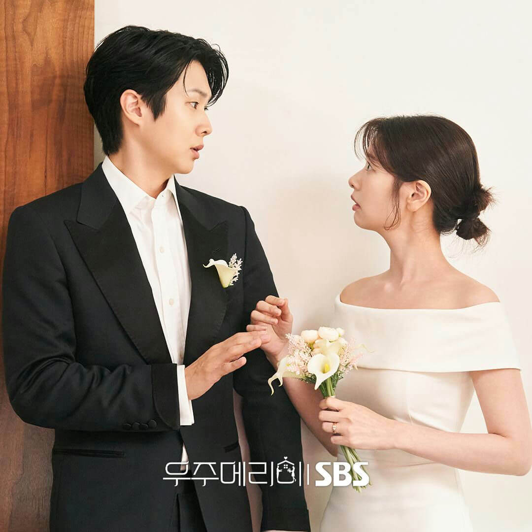 people-man and woman-A-wedding attire-B-looking at each other-C-holding hands/flowers