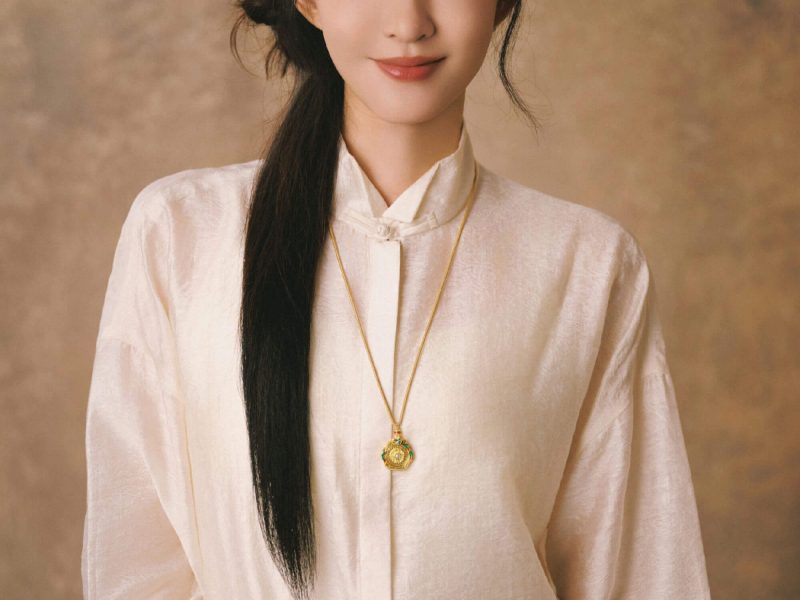 people-woman-elegant-A-traditional collar shirt-A-long dark hair-A-gold necklace-A-peach skirt