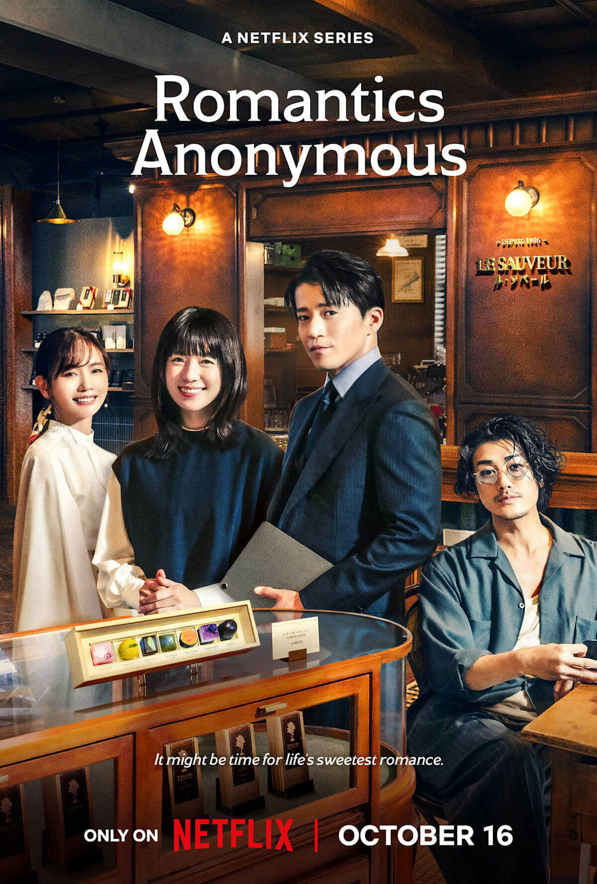 people-Three women and one man standing or sitting in what appears to be a chocolate shop or cafe-A-smiling-A-chocolate display case-A-Netflix series poster-A-romantic comedy