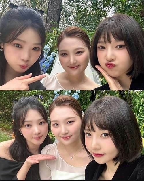 people-three young women-A-wedding/bridal setting-B-posing for selfie-C-outdoor greenery
