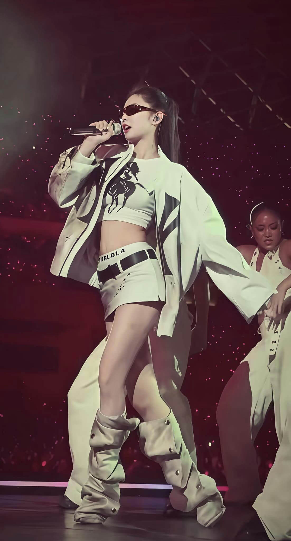 people-female performer-A-singing-A-white outfit-A-sunglasses-A-stage performance