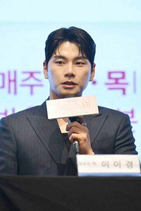 people-man-speaking-microphone-holding-sign-suit