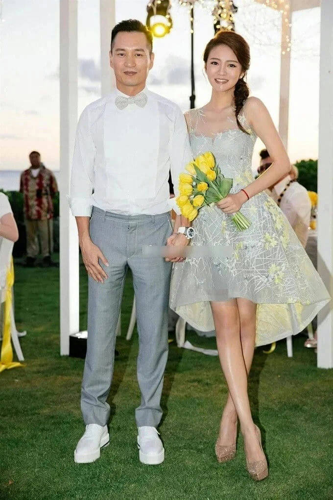 people-couple-A-formal casual wear-A-yellow tulips bouquet-A-outdoor setting-A-smiling