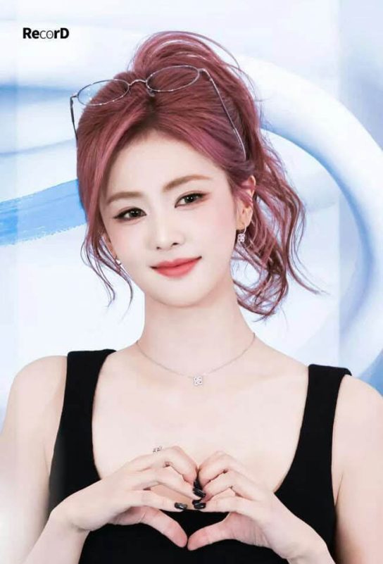 people-woman-A-pink hair in high ponytail-B-black tank top-C-making heart shape with hands