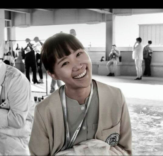 people-woman-smiling-A-indoor-setting-A-short-hair-A-uniform