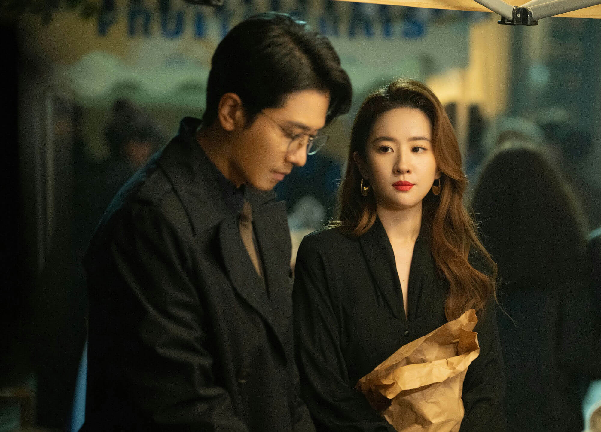 people-2-man-A-woman-A-dark-attire-B-brown-bag-C-night-setting