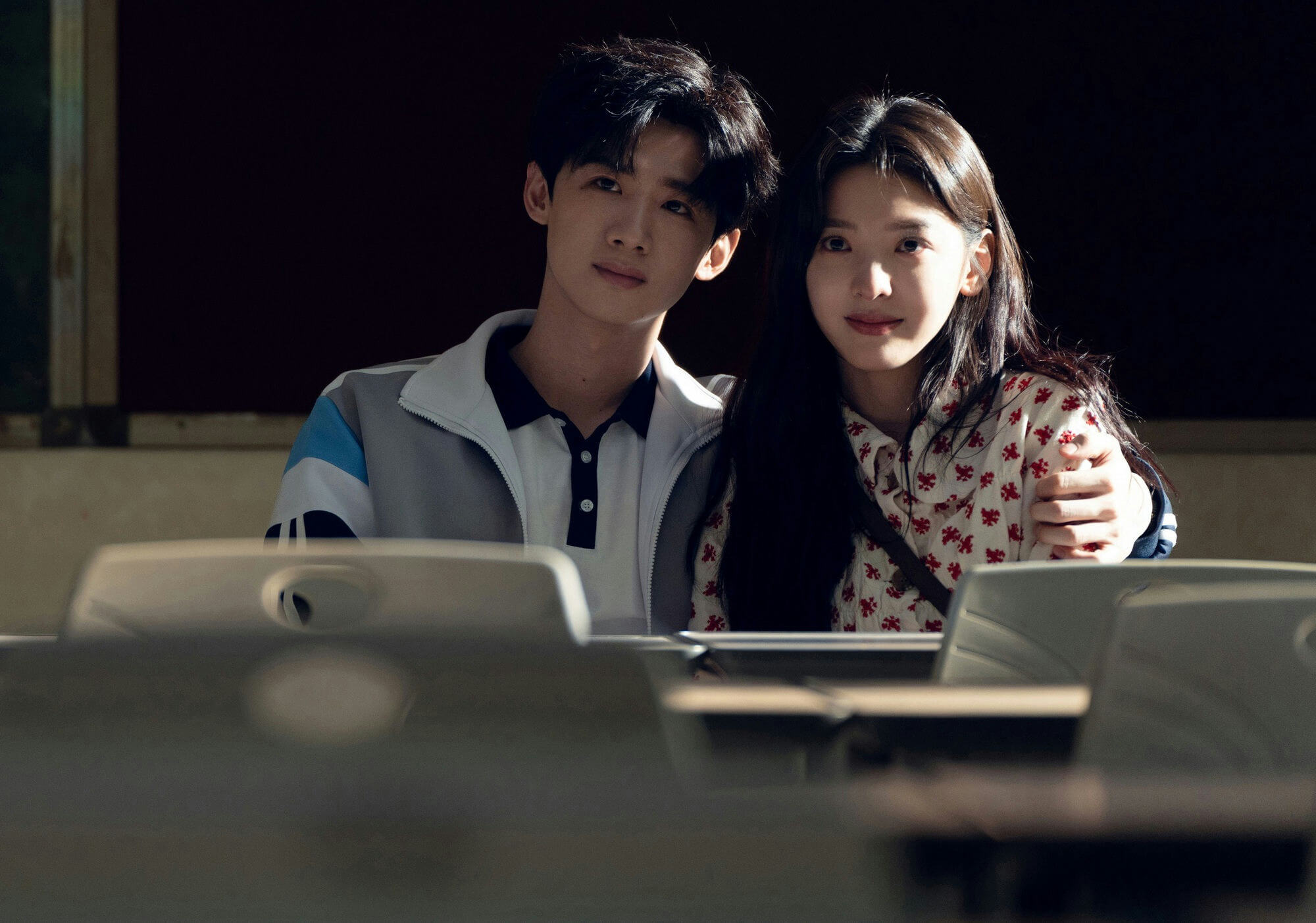 people-A-male student-A-female student-A-classroom setting-A-intimate pose-A-backlit