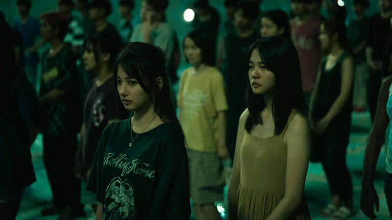 people-two-young-women-A-crowd-A-dark-lighting-B-green-tint-C