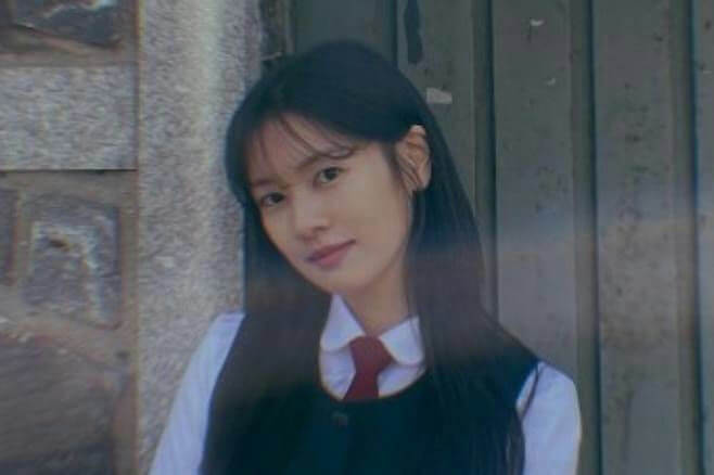 people-A-young woman-A-dark hair-A-school uniform-A-outdoor setting