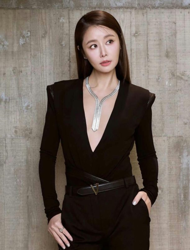people-woman-A-black outfit-B-deep V-neck-C-diamond necklace