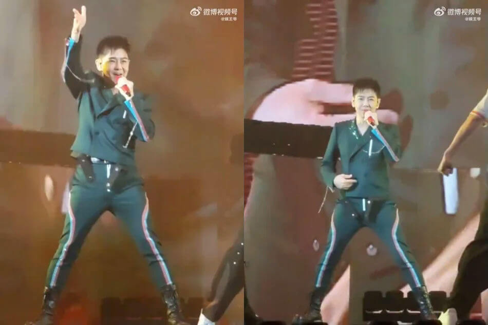 people-Male singer-A-stage performance-A-dark green suit with colored stripes-A-holding microphone-A-combat boots