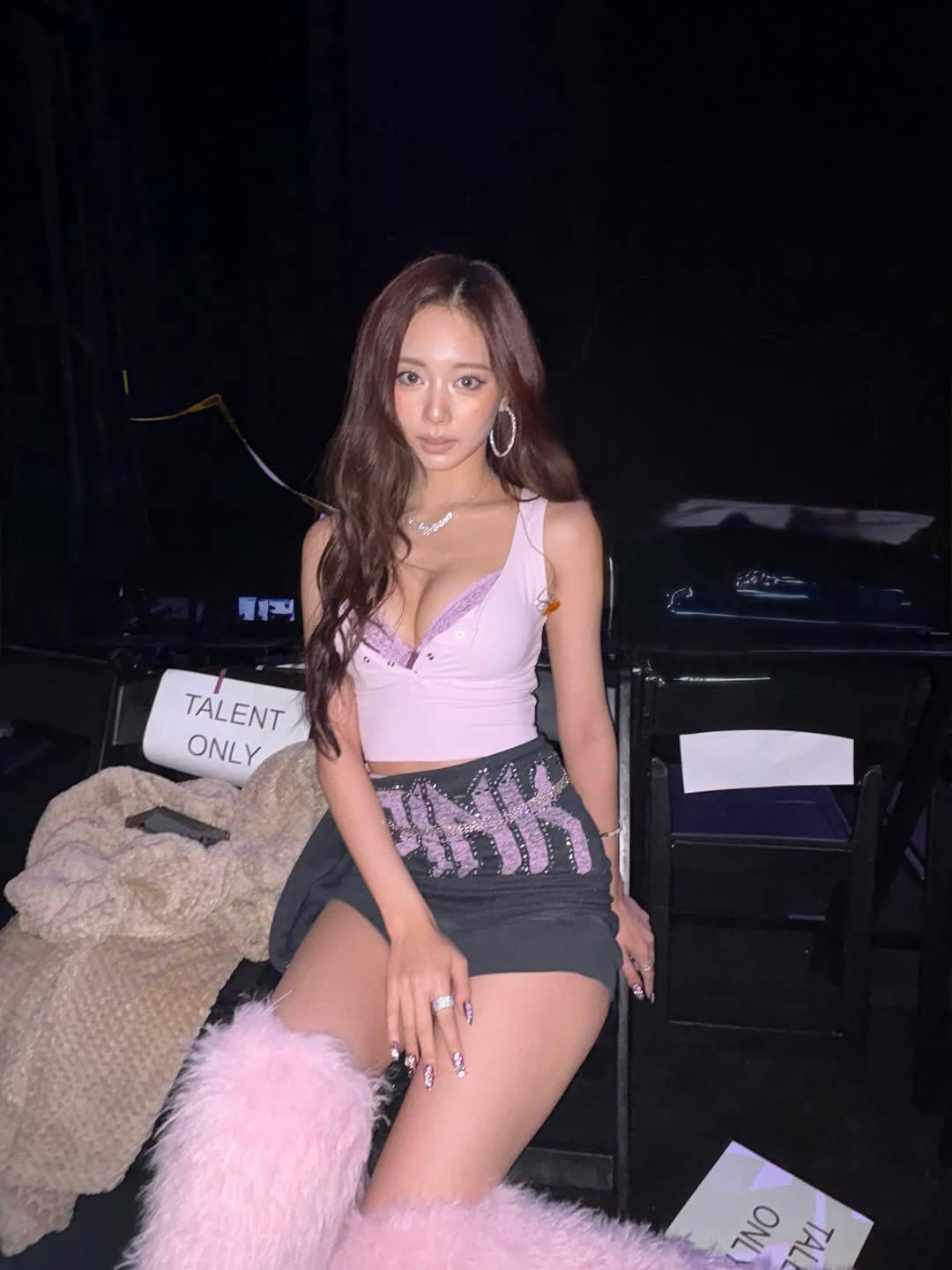 people-1-woman-A-long brown hair-B-pink lace crop top-C-black embellished mini skirt